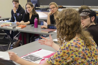 Margo Fritz contributes to the discussion in the creative writing course taught by visiting writer Sandra Beasley (left).