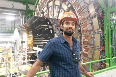 Raghav Kunnawalkam Elayavalli ’11 in front of the Compact Muon Solenoid experiment,  one of two large general-purpose particle physics detectors built on the Large Hadron Collider.