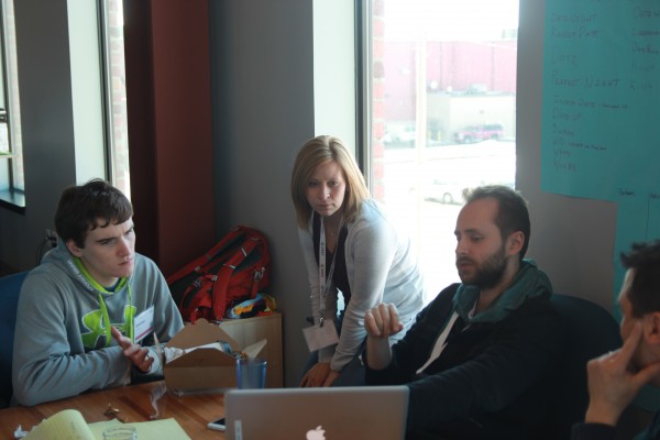 Brennen Hicklin ’15 (left) and Rebecca Sullens ’09, associate director of the Berry Center, during Startup Weekend-Cedar Rapids. The pair was on the team that won first prize.