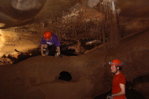 Rhawn Denniston (right), professor of geology at Cornell College, with Dan Cleary ’13, a member of his student research team, examining stalagmites in an Australian cave.