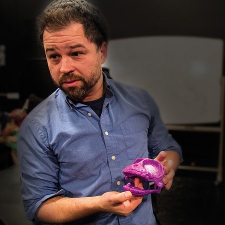 Michael Schupbach, a member of the Puppet Kitchen troupe, shows off the 3D-printed puppet skull he made with the theatre department’s 3D printer.