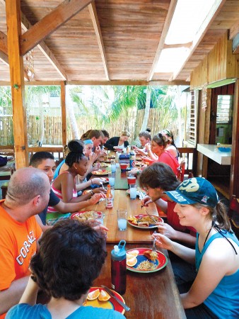  Cornell anthropology and biology students enjoy lunch at the International Zoological Expedition field station in South Water Caye, Belize. Photo by Craig Tepper