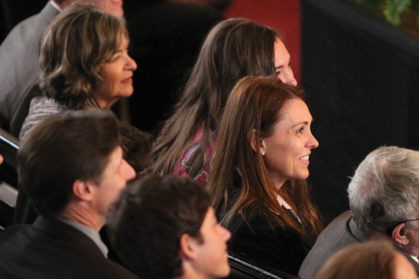 Rachelle LaBarge, wife of Jonathan Brand, enjoys the ceremony with family.