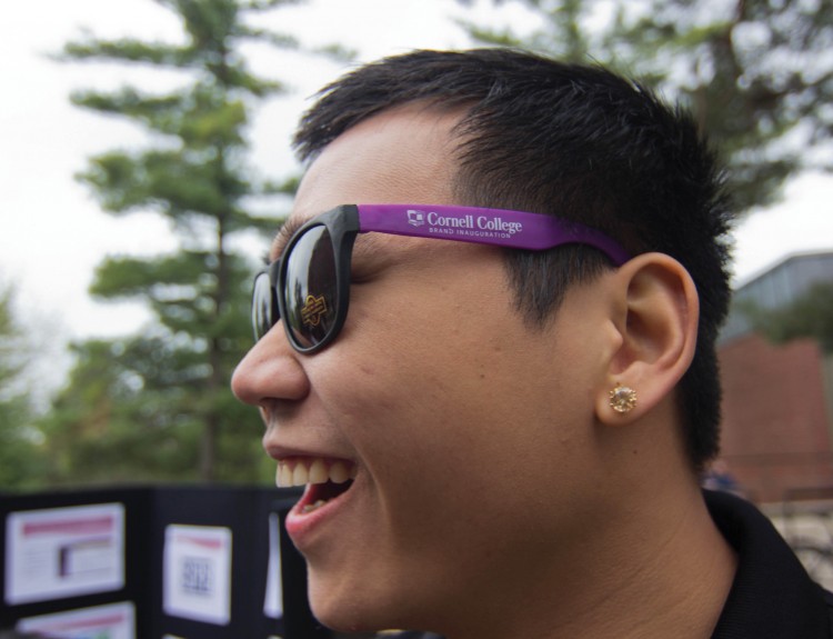 A student happily sports the inaugural sunglasses given out during the Student Street Fair