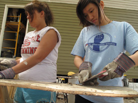 Each year, dozens of students take part in Alternative Spring Break, and spend a week in March in service to others. In 2009 and 2010, students went to New Orleans to help repair damage from Hurricane Katrina (Photo by Tom Javoroski)