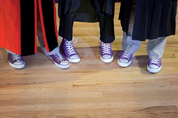 Cornell President Jonathan Brand (from left) and trustees Judy Hesler Jorgensen ’60 and Robert McLennan ’65 show off their purple Converse Chuck Taylor All-Stars after Homecoming Convocation on Oct. 10. Jorgensen was given the Distinguished Achievement Award, and McLennan received a Leadership and Service Award 