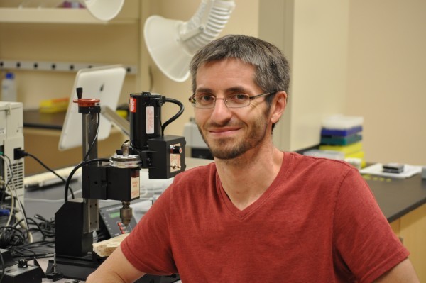 Jonathan Baker, who is giving the Anderson Natural Science Lecture on Nov. 11, with the drill he used to analyze stalagmites from caves in the southern Ural Mountains.