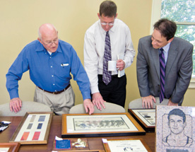 Lowell Lange '50 talks with director of Athletics John Cochrane and Vice President for Alumni and College Advancement Peter Wilch '94