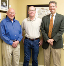 Lange with legendary Iowa wrestler Dan Gable and Cornell President Jonathan Brand