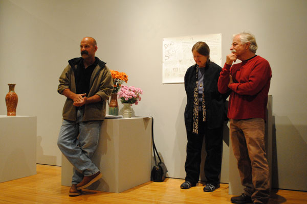 About 25 alumni exhibited their art as part of the "Doug Hanson Legacy" show in October. Here, Hanson stands with David Rega '77 and Leila Denecke '72. Photo by Tiffany Monreal '14 