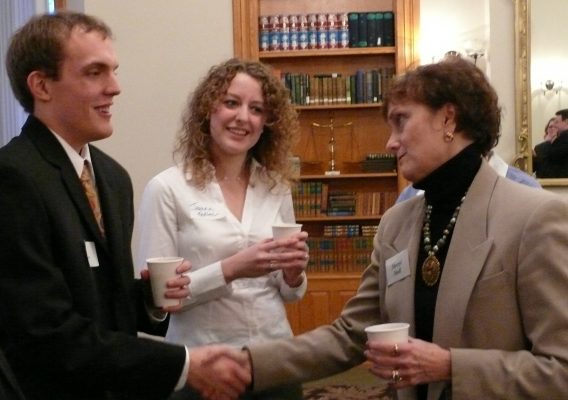 Trustee Sheryl Atkinson Stoll ’70 speaks with Ben Sebers ’09 and Jeanna Kadlec ’10, who were then students, at an early Pre-Law Program mentoring event.