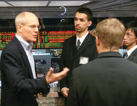 Students in Professor Chris Conrad's Financial Management Seminar course spent three days in Chicago in February. One day was dedicated to the Chicago Board Options Exchange. Pictured are juniors Andre DeSouza and Khol Luu talking with former CBOE trader and current instructor of the Options Institute, Jimm Bittman. (Photo by Frank Dixson '10)