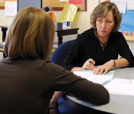 Jen Swanson, director of Career Services, offers advice to a job-seeking student. Swanson and Laura Obrycki, assistant director of career services, have taken Career Services at Cornell digital. (Photo by Aaron Hall '10)