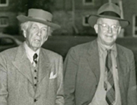 Frank Lloyd Wright (center) strolls the Hilltop in this photo dated "1934 or 1946." 