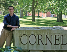 That's me, Blake Rasmussen, standing by the Cornell sign. Getting to this point took some luck, a bit of kismet, and a healthy push from Cornell. I'm glad I took the leap. (Photo by Emily Vinci)