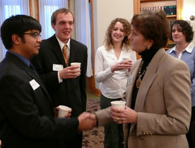 Kasun Wijegunawardana '10, left, greets attorney and Cornell trustee Cheyl Stoll '70 at a Pre-Law meet and greet.