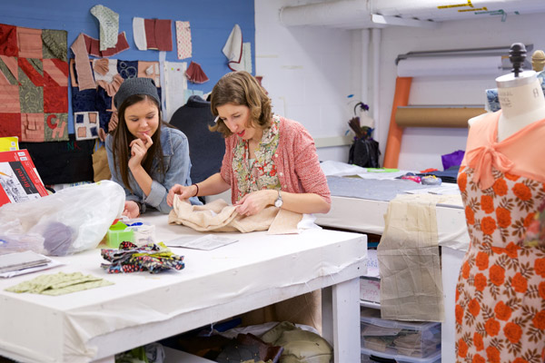Theatre lecturer and costume shop su[ervisor Jenny Kelchen (right) works with students in her Costume Construction class. (Photo by Allan Recalde)