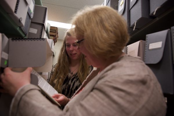 Professor of History Catherine Stewart works with Hannah Robertson '18 on historical research during the summer of 2016