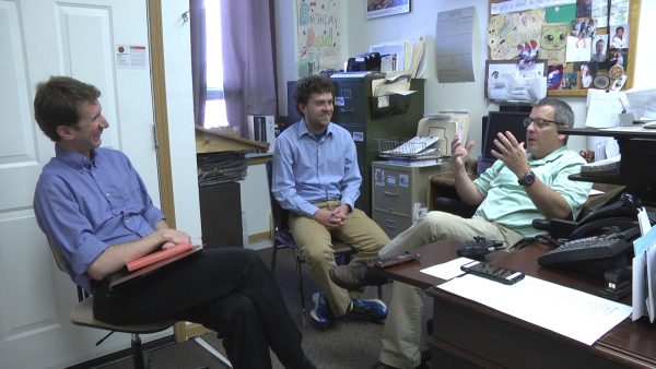 Professor Hans Hassell and Zach Stoll '18 meet with Jake Krob