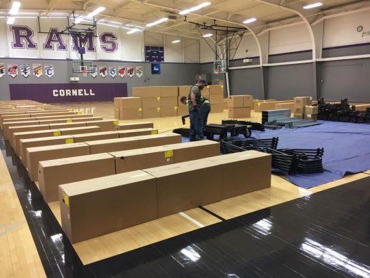 Picture of crews delivering new bleachers for the gym