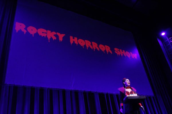 Actress sings on stage for "The Rocky Horror Show"