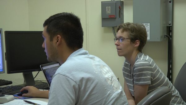 Carlos Tellez works with Professor Emily Walsh.