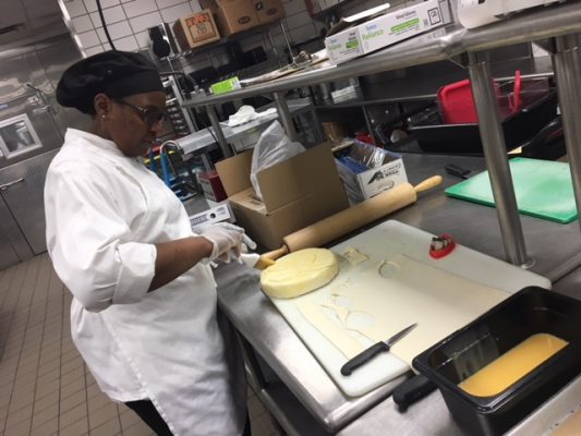 Austina Smith working in the kitchen at Cornell College