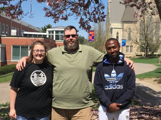 group picture of Dylan Davison, Wesley Adcock, and Suleiman Shehu on the Cornell College campus