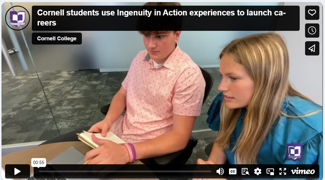 two students working together on a laptop during an internship.