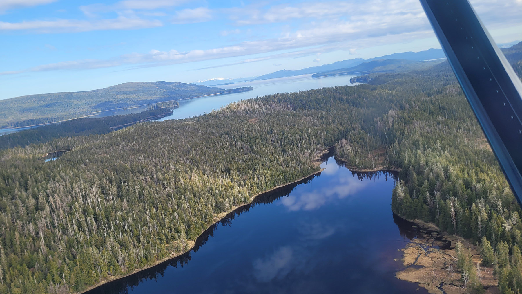 A view of Slippery Lake and the Pacific Ocean from the float plane before snorkeling Slippery Creek.