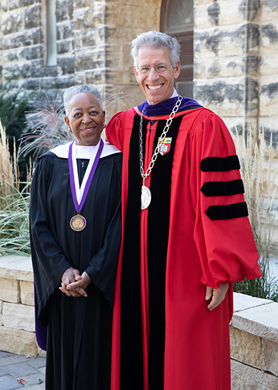 Madgetta standing with President Jonathan Brand