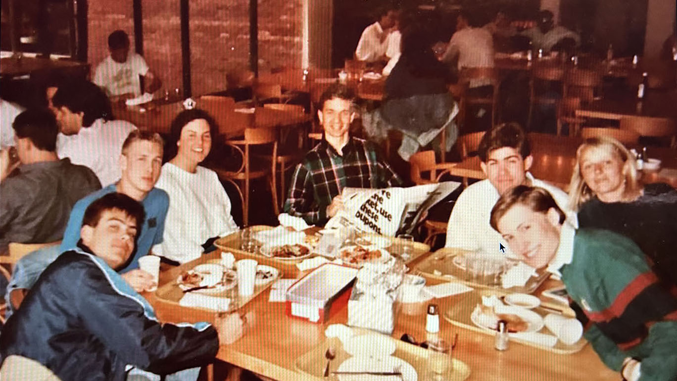 Lunch Crew members gathered around a table at lunchtime in 1980.