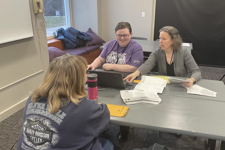 Students and community member doing tax preparation