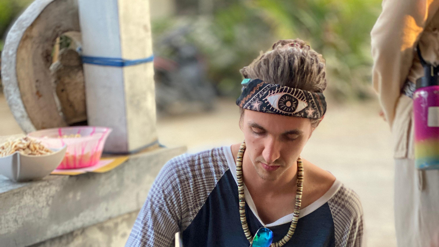Beckett cooks food in a large bowl.
