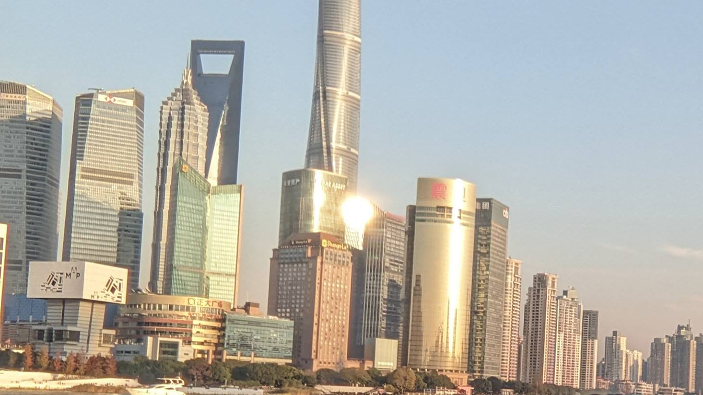 Kimberly Maitland ’24 with the Shanghai skyline behind her.