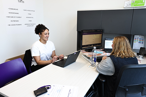 Washington meets with Head Women's Lacrosse Coach Meredith Meier.