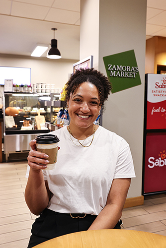 Washington holds up a coffee cup