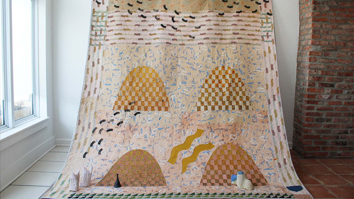 A large quilt and other art pieces by Condon #amp; Shull.