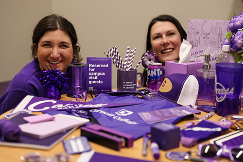 Lizzy Ott and Megan Dietsch with a lot of purple stuff.
