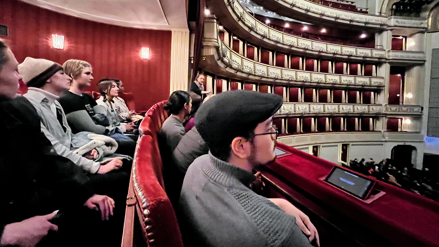 Students sit in box seas at the Vienna State Opera