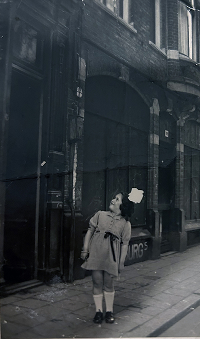 Rodi Glass pictured as a child standing near a street.