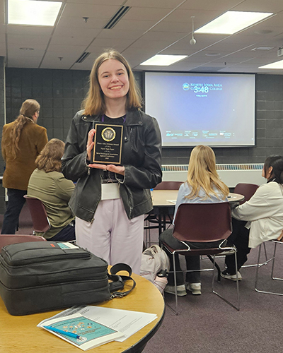 Sophomore Celina Schertz ’27 holds the Mary Alice Ericson Award
