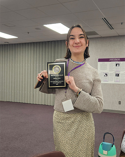 Laura Sander ’25 holds the Ward Reynolds recognition for best criminal justice paper