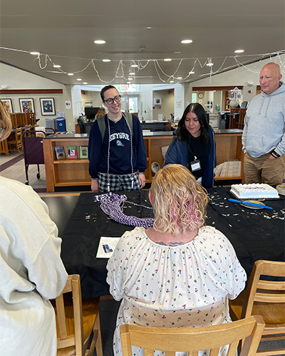 Students pick up special graduation cords.