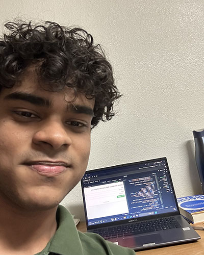Ashish Ranjan '28 in front of his computer where he coded RAMS Wash.