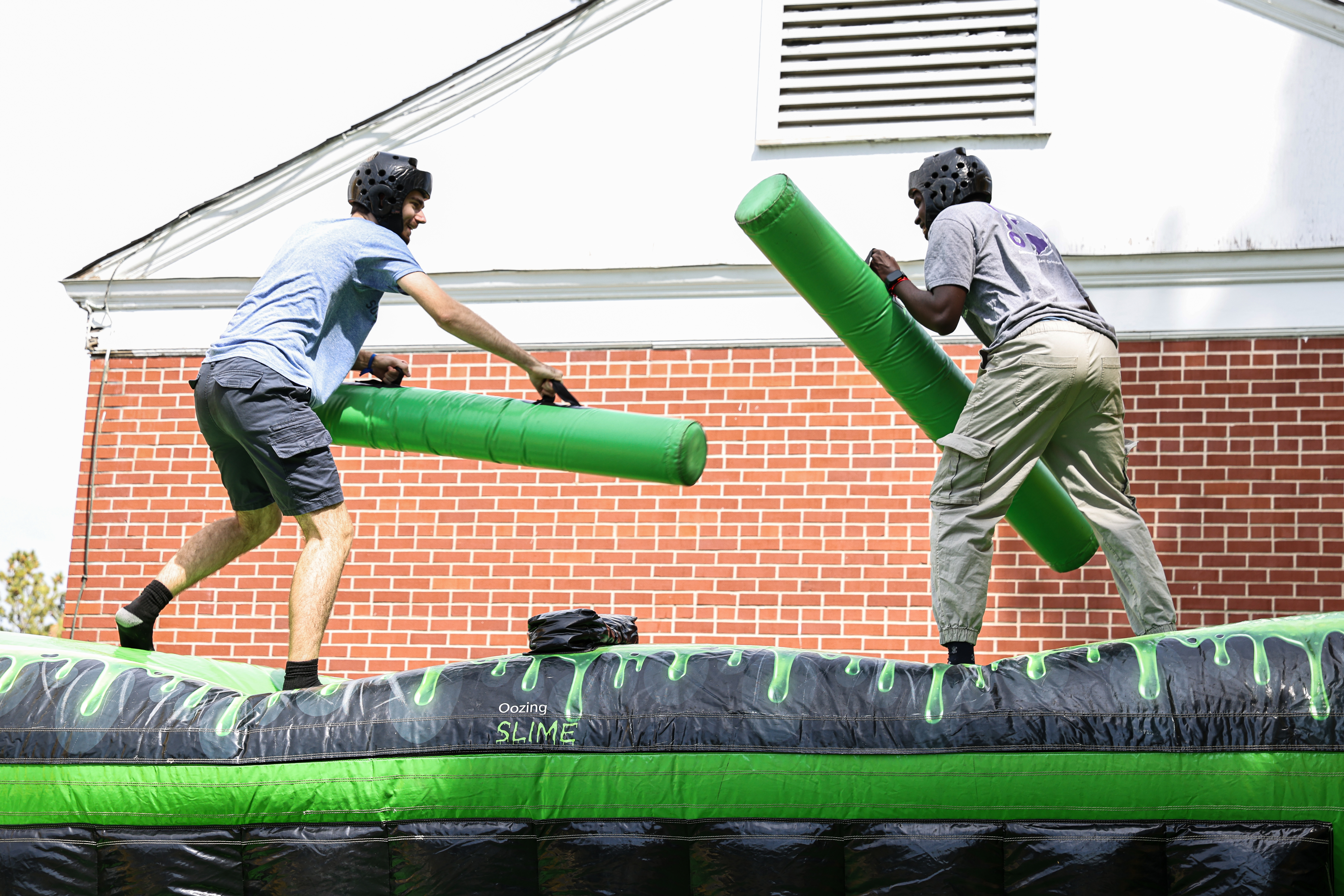 Two students try to knock each other over at Ramapalooza