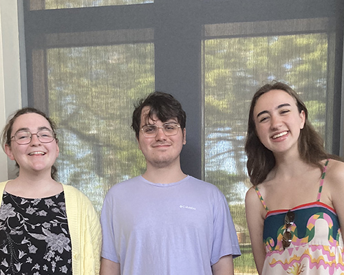 The three students who created the Centennial display.