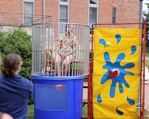 A student sits in the dunk tank at Ramapalooza.