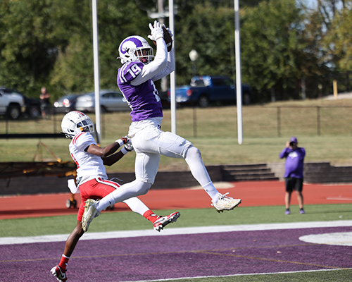 Sophomore Mason Dew catches the football in the Homecoming game.