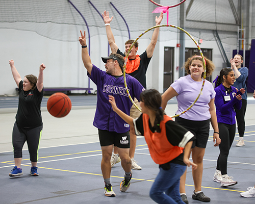 Students play an adapted game of basketball